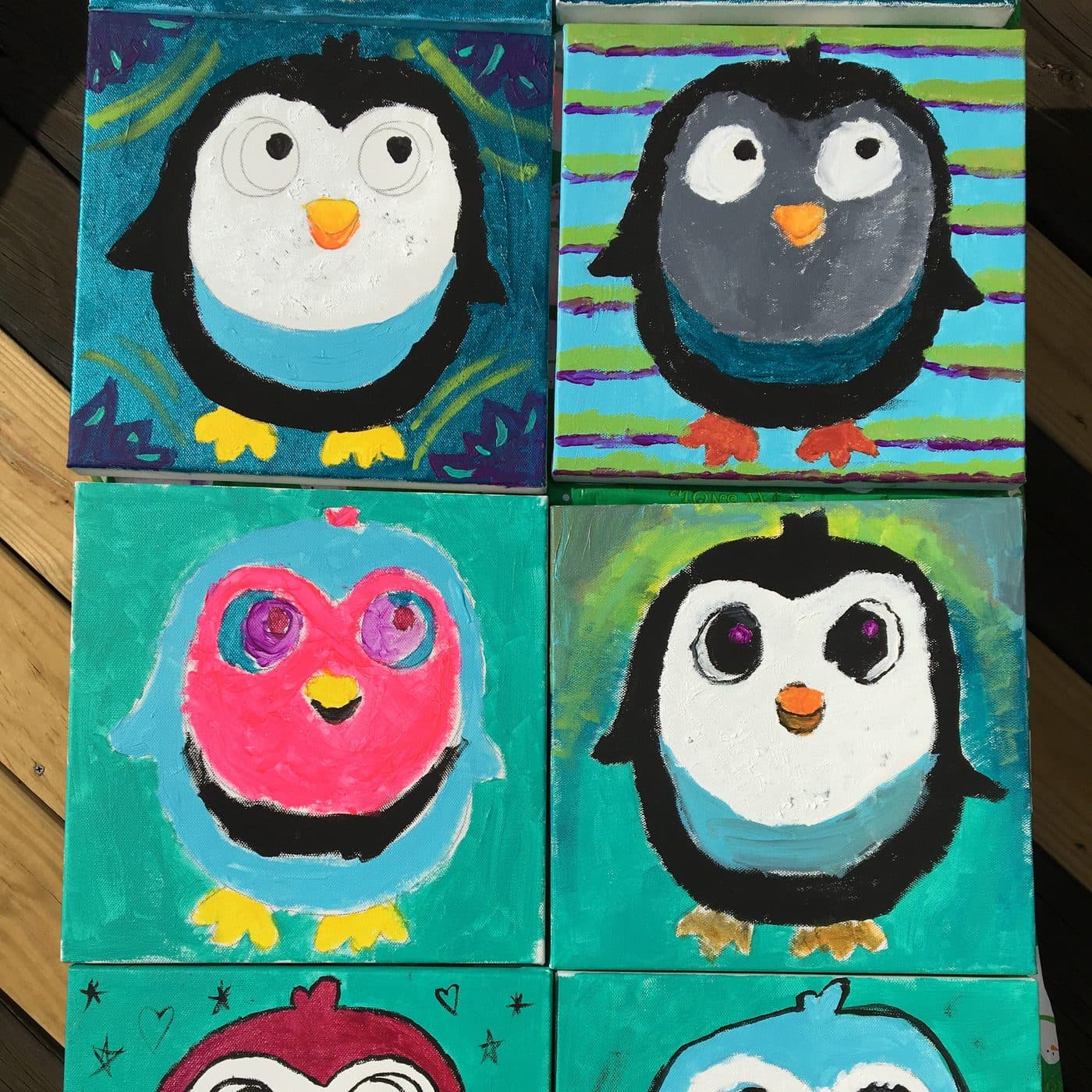 Six colorful penguin canvas paintings by kids